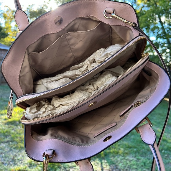 Cute Michael Kors pink bag. Holds a lot of stuff. Has three compartments. - Picture 6 of 7